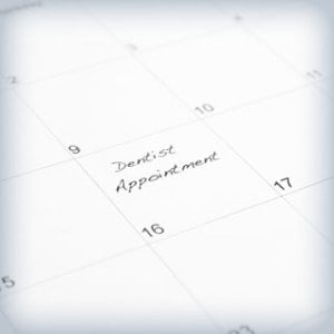 'Dentist Appointment' written on a calendar
